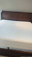 Headboard, side rails, footboard and mattress viewed head-on