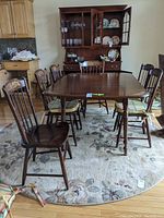 Frontal view showing table, chairs and hutch in background