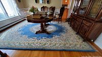 Overall view of rug under dining table in room setting