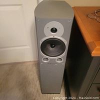 Front view of one Wharfedale Diamond 9.4 speaker showing tweeter, woofer, and bass ports