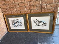 Pair of framed and matted artworks leaning against brick wall, showcasing the two pieces side by side.