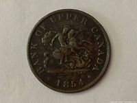Front side of the 1854 Upper Canada 1/2 Penny showing the horseman and date