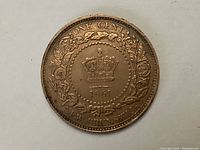 Reverse side showing crown within wreath, date 1861 and inscriptions ONE CENT and NEW BRUNSWICK