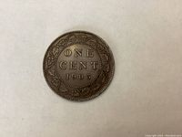 Reverse side of the coin with denomination 'ONE CENT' and date 1903 surrounded by maple leaf wreath