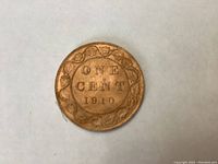 Reverse side of 1910 Canadian large penny showing 'ONE CENT 1910' inside a wreath.