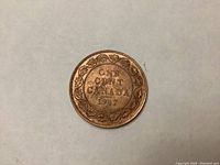 Reverse side of the 1917 Canadian Large Penny featuring the denomination, year, and decorative wreath.