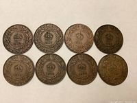 Reverse sides showing crown above 'ONE CENT' surrounded by wreath and 'NEWFOUNDLAND' inscription below, dates visible: 1917 (two coins), 1920, 1921, 1923 (two coins), 1919, plus one very worn coin.