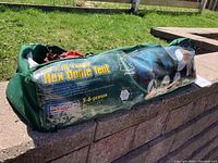 Tent bag with printed label showing model, size, and capacity