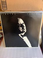 Front cover of one of the Frank Sinatra Trilogy LP records showing high contrast monochrome portrait of Sinatra with the word 'Trilogy' at the top.