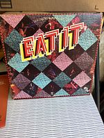 Front cover of Humble Pie Eat It double LP album with colorful geometric design and title text.