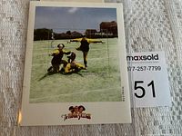 The Three Stooges foreign stamp affixed to a backing card with full image and surrounding text visible.