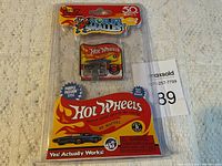 Photo of the 2018 World's Smallest Hot Wheels Purple Passion model in original blister packaging with collector card.