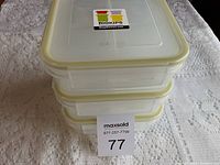 Stack of three Biokips containers with brand label and yellow lids