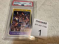 Front view of the 1988 Fleer Kareem Abdul-Jabbar #64 basketball card graded Mint 9 by PSA encapsulated in a protective case.