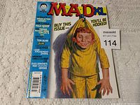 Front cover of MAD XL magazine from July 2003, showing main title, cover art, and content highlights on blue side banner.