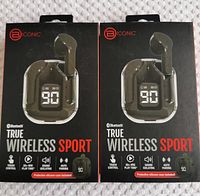 Two unopened Bionic True Wireless Sport earbuds boxes with black earbuds and charging case shown on packaging.