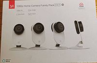 Front of box showing 4 YI 1080p Home Cameras featuring HD, wide-angle, two-way audio, night vision, and Alexa compatibility.