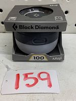 Front of Black Diamond Moji lantern packaging showing the product light and branding.