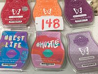 Top view of six different Scentsy scented wax bars arranged in two rows of three. Visible scent names and labels for identification.