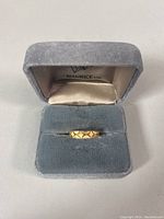 Ring presented in gray velvet Maurice Ltd jewelry box