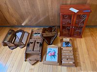 Photo showing all six pieces including the mirrored candle shelf, wooden key box, calendar, clock, picture frame, and heart-shaped side wooden shelf.