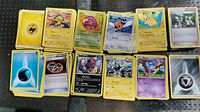 Over 600 assorted Pokemon trading cards including Electric, Water, Fighting, and Metal Energy cards and several Pokemon cards laid out