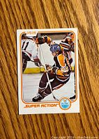 Front of the 1981-82 O-Pee-Chee Wayne Gretzky hockey card showing the player in action in an Edmonton Oilers jersey with number 99 and Super Action text.