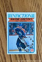 Front photo of 1982-83 O-Pee-Chee Wayne Gretzky hockey card showing image of Gretzky in Oilers uniform on ice.