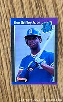Front of the 1989 Donruss Ken Griffey Jr Rookie Card showing the player in uniform with a bat and Rated Rookie logo.