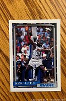 Front of 1992-93 Topps Shaquille O’Neal rookie card showing O'Neal in basketball action pose with Orlando Magic uniform.