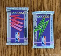Two sealed packs of 1991-92 Skybox NBA basketball cards, front view.