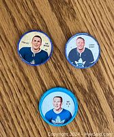 Front side of all three hockey coins showing player portraits.