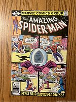 Front cover of The Amazing Spider-Man #199 comic book showing Spider-Man and Mysterio in an action scene