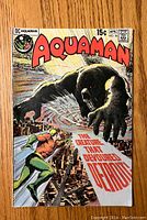 Front cover of the Aquaman #56 vintage comic book showing main artwork and title