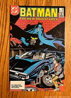 Front cover of vintage Batman comic book Issue #408 showing Batman and a character with a car on the cover.