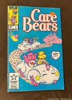 Front cover of Care Bears #1 comic book showing colorful Care Bears driving a cloud car, cover price 65 cents, published by Star Comics and Marvel.