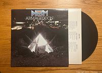 Front of album cover with vinyl record partially visible