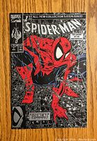 Front cover of Spider-Man #1 vintage comic book showing Spider-Man in classic pose with detailed black and red web background and title 'Torment Part One of Five'.