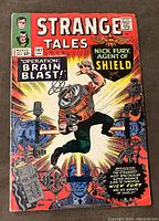 Front cover of the Strange Tales #141 comic book showing the character in helmet and 'Operation: Brain Blast!'
