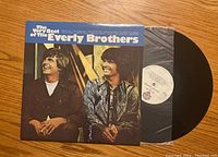 Front cover of The Very Best of The Everly Brothers vinyl record showing two men smiling and album title.