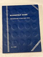 Closed blue Whitman coin collection folder titled 'Roosevelt Dime Collection Starting 1946' with coin slots embossed on cover.