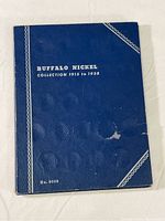 Blue cover of Buffalo Nickel Collection coin album from 1913 to 1938, with visible wear marks.