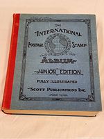 Front cover of the vintage stamp album showing the title, edition, and publisher.