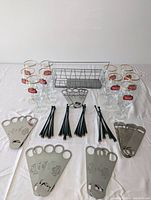 Full overview of the lot showing all glasses, swizzle sticks, bottle openers and storage basket.