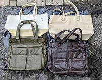 All four handbags together showing front side with handles and pockets