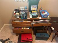 Desk surface with various stationery items, file organizers, briefcase, and IBM IS-8 paper shredder visible underneath the desk.