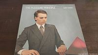 Front cover of The Pleasure Principle album by Gary Numan showing Gary Numan in a suit.