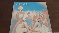 Front cover of the vinyl album Beauty and the Beat by the Go-Go's, showing five women in towels and turbans.
