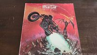 Front cover of the Meat Loaf 'Bat Out Of Hell' vinyl album showing motorcyclist artwork