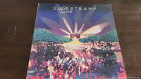 Front cover of Supertramp Paris album showing colorful artwork and title.